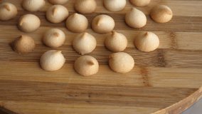 Rotation Of Small Round Biscuits Laid Out On A Round Wooden Board Video In 4K Resolution
