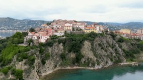 This aerial drone video shows the old city of Agropoli, in southern Italy. The old city center can be found on top of a cliff and you have a beautiful view over the Mediterranean sea. 