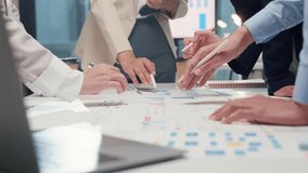 Closeup happy young Asia businesspeople meeting brainstorming some new ideas about project to his partner working together planning success strategy enjoy teamwork in small modern home office. - Powered by Shutterstock - Get 15% off with code: PIKWIZARD15