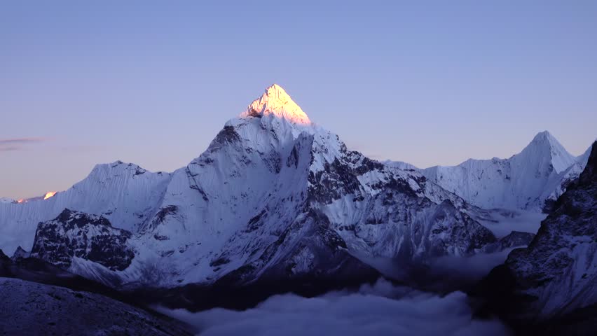 lit Peak of Ama Dablam Himalaya 8000 meter mountain. sunset with clear blue and purple sky, 2023
 Royalty-Free Stock Footage #1103822729