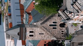 Alesund, Norway. Alesund Skyline Cityscape. Historical Center In Sunny Summer Day. Famous Norwegian Landmark And Popular Destination. Top View. Old Alesund Church. Vertical Footage Video.