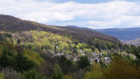 Valley town perfect spring weather Bradford Pa moving clouds natural light 4k resolution clip