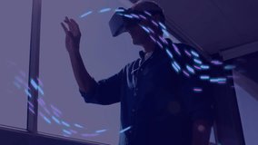 Animation of glowing light trails of data transfer over caucasian man in vr headset. Global virtual reality, data processing, computing and digital interface concept digitally generated video. - Powered by Shutterstock - Get 15% off with code: PIKWIZARD15