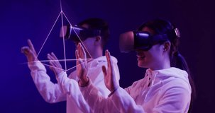 Animation of glowing 3d shapes over asian people using vr headset. Global virtual reality, computing, digital interface and data processing concept digitally generated video.