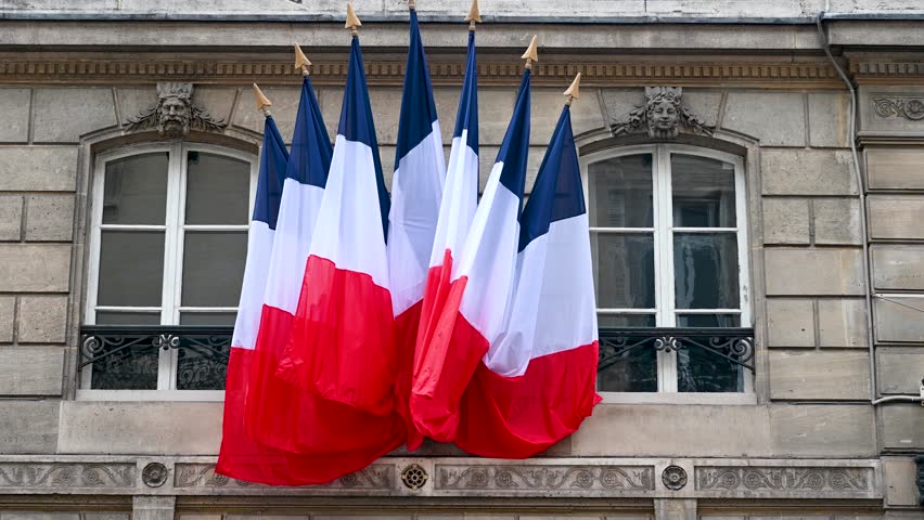 Flags of France on Elysee Palace, official residence of the President of Republic of France. French flags on building in Paris, France. Royalty-Free Stock Footage #1103859481