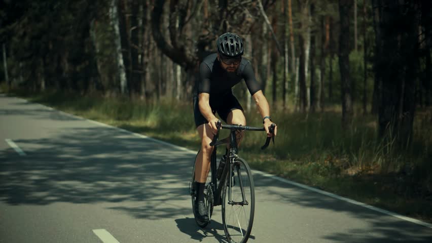 Triathlete Cyclist Training On Bicycle. Sport Recreation Workout.Fit Athlete Sport Workout Training Cycling Triathlon Competition. Cyclist Fitness Cycling Road Bike For Triathlon Race Recreation Sport Royalty-Free Stock Footage #1103860109