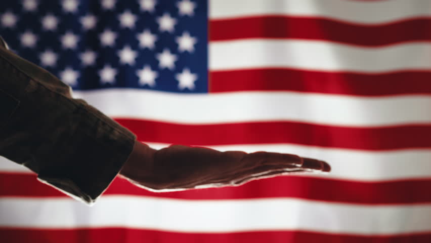 Hand of Militar holding plate against american flag for memorial day
