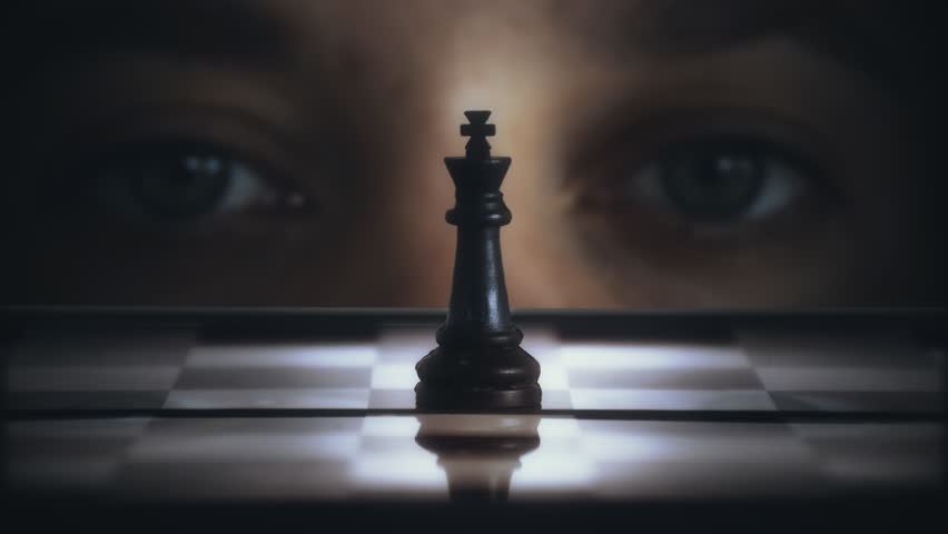 Player Look Chess King Close Up Chessboard Strategy Game Zoom In. Eyes of a person looking over a chess king on the chessboard, close up. Zoom in Royalty-Free Stock Footage #1103863989