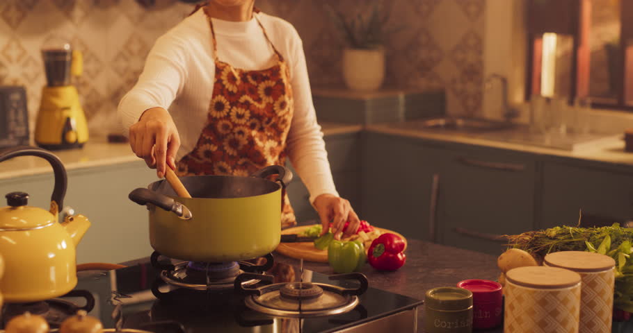 Indian Girl Preparing Food: Magnificent Young Woman Preparing Delicious Home Cooked Traditional Meal, Beloved Boyfriend Embraces Her Lovingly. Celebrating Traditional Culture. Slow motion Mid Portrait Royalty-Free Stock Footage #1103864113