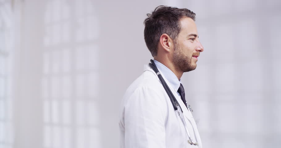 Healthcare, happy and a man doctor arms crossed in the hospital for insurance or medical treatment. Portrait, medical and smile with a young male medicine professional standing in a health clinic Royalty-Free Stock Footage #1103867753