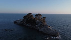 4k video. Montenegro. A circular drone flight over the island of Katic. 30 meters high.