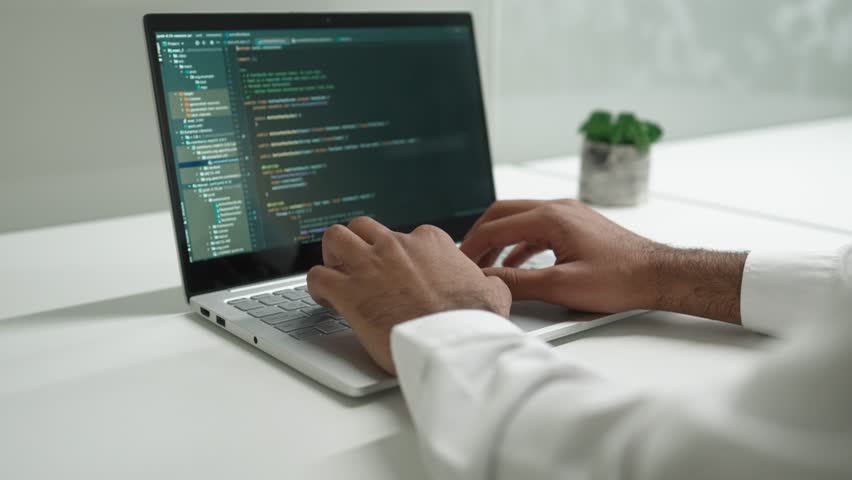 Close-up of screen where visible programming code for clients. Developing software of web sites, programs or apps on laptop. Working at office. Using technology. Developer concept. Royalty-Free Stock Footage #1103872561
