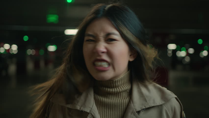 Mad angry crazy Asian korean chinese japanese girl shout in car parking furious woman annoyed businesswoman client speak loud screaming talk solve conflict feel anger rage talking scream webcam view