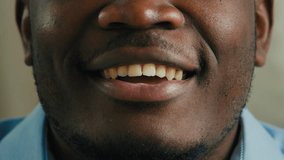 Cropped shot African American face part male man businessman blogger vlogger say tell video blog talking speech. Close up mouth lips dental toothy smile oral health care happy unrecognizable guy talk