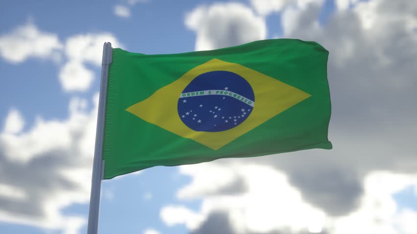 Brazil flag waving in the wind, blue sky background