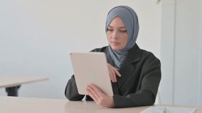 Online Video Chat on Tablet by Muslim Businesswoman