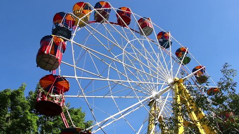 People ride on the Ferris wheel at the town festival