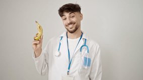 Young arab man doctor pointing with finger to banana over isolated white background - Powered by Shutterstock - Get 15% off with code: PIKWIZARD15
