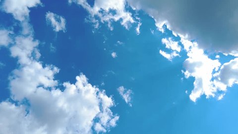 Blue sky white clouds. Puffy fluffy white clouds. Cumulus cloud cloudscape timelapse. Summer blue sky time lapse. Nature weather blue sky. White clouds background. Cloud time lapse Adlı Stok Video