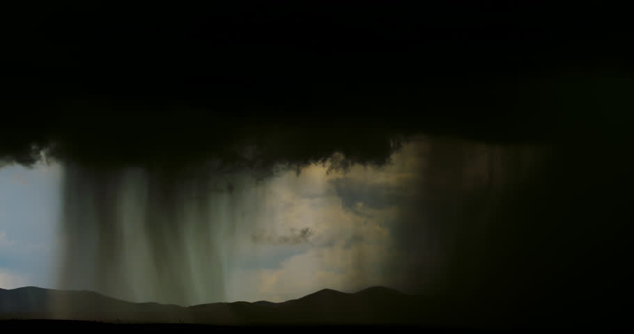Heavy monsoon thunderstorm with intense desert downpour.