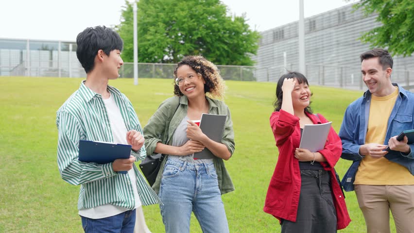 Multinational youth group having a conversation in the square.