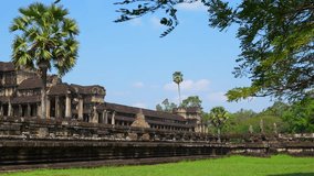 Ancient ruins Angkor Wat temple - famous Cambodian landmark. Siem Reap, Cambodia. Timelapse.