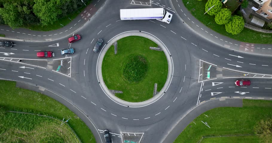 5k footage of a drone. Roundabout aerial top view with cars passing by Royalty-Free Stock Footage #1103908133