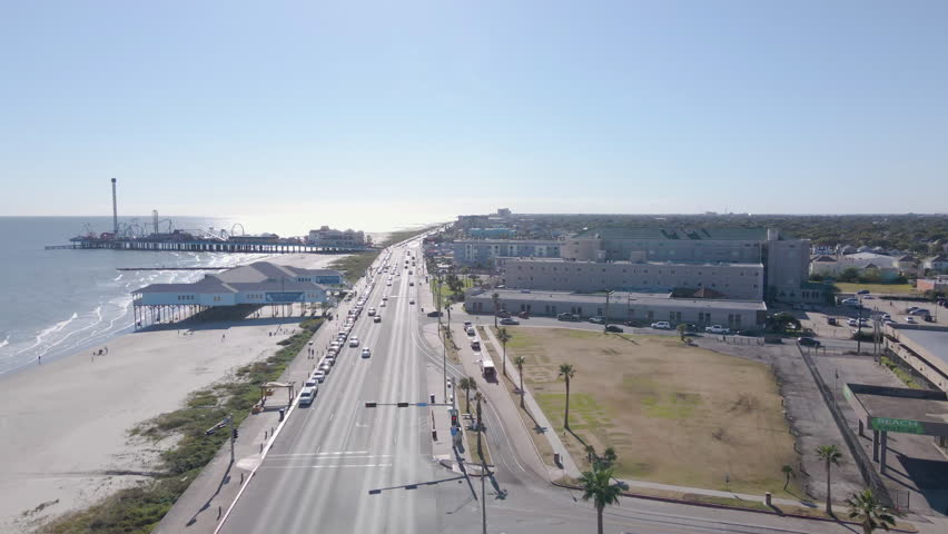 Pleasure pier road intersection at sea wall boulevard in Galveston Texas, aerial