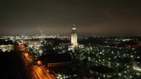 Louisiana state capitol building in Baton Rouge, Louisiana at night with drone video moving at an angle.