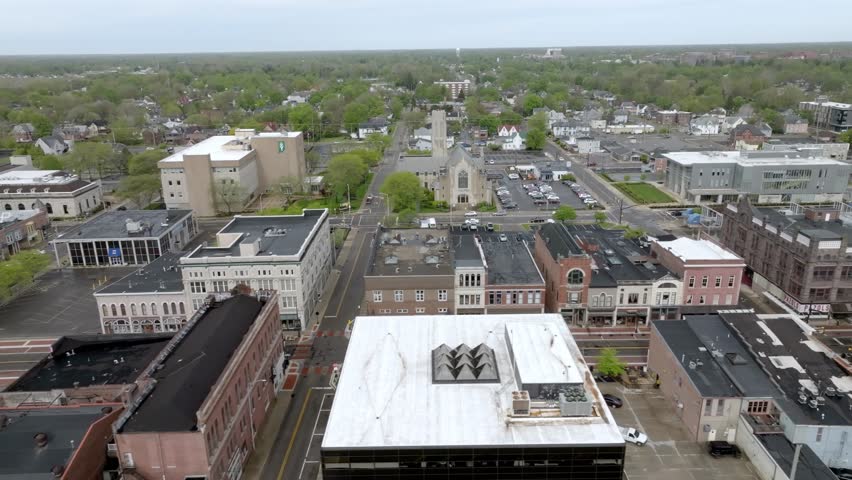 Downtown Muncie, Indiana with drone video moving sideways close up.