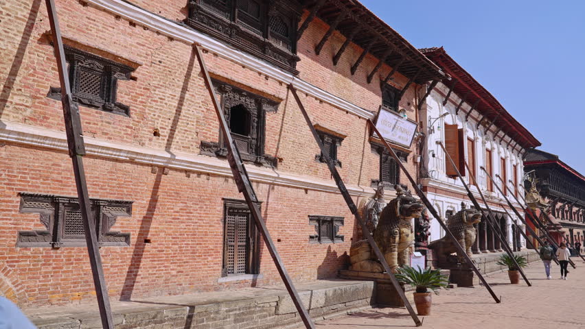 National Art Museum in Bhaktapur Durbar Square being held up by wood planks after the 2015 earthquake, Kathmandu Valley, Nepal