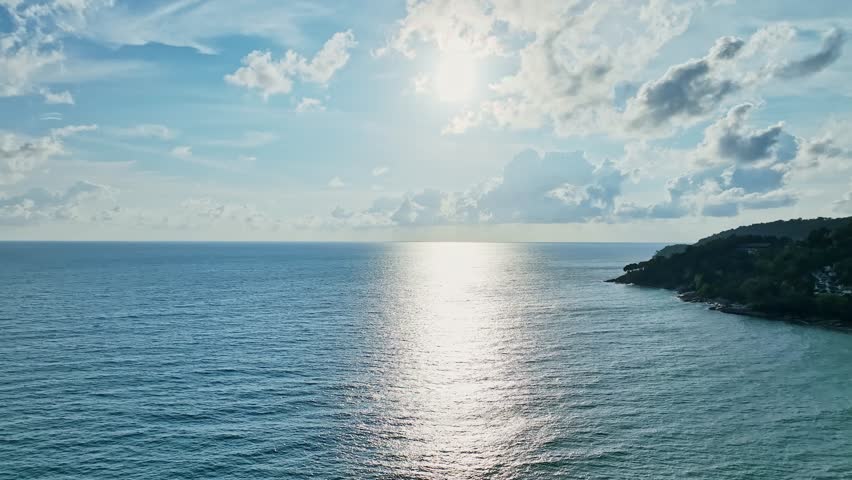 Beautiful Sea in summer season, white clouds and blue sky footage from drone,High angle view nature background	 Royalty-Free Stock Footage #1103932349