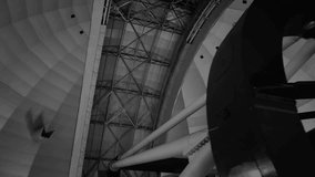astronomical observatory, telescope. black and white shot inside the astronomy station. geosphere observatory dome, tracking stars while the door opens. - Powered by Shutterstock - Get 15% off with code: PIKWIZARD15