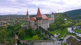 Aerial footage of the Hunedoara Castle in Romania. Video was shoot from a drone at a lower altitude while flying forward with the castle in the view. Camera was level for a panoramic view.