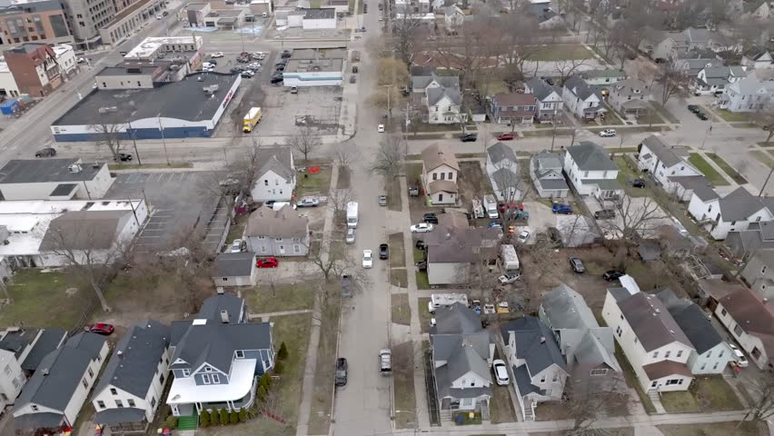 Neighborhood in Grand Rapids, Michigan with drone video moving left to right.