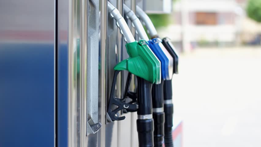 Hand Putting Back Gasoline Nozzle into its Place After Car Refueling at Gas Station. Filling Up the Gas Tank. Close-up of a Man's Hand Using a Fuel Nozzles. Gasoline and Diesel Fuel Prices Update. Royalty-Free Stock Footage #1103949641