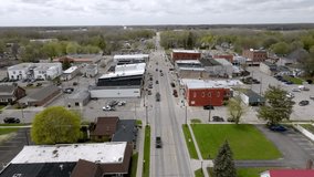 Downtown Fowlerville, Michigan with drone video moving forward.