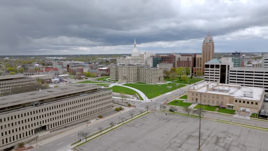 Michigan State Capitol building in Lansing, Michigan with drone video moving in.