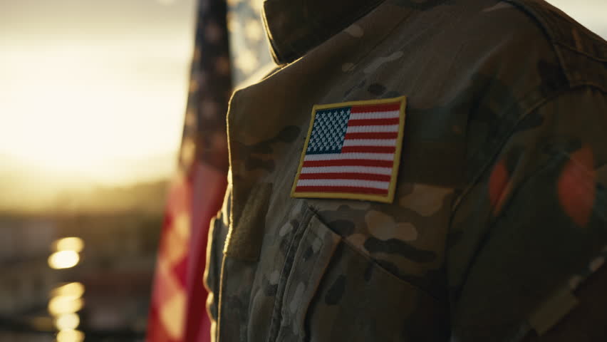 American flag on chest of military man praying for memorial day Royalty-Free Stock Footage #1103952411