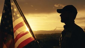 Silhouette of Military Salute of soldier for memorial day against flag at sunset - Powered by Shutterstock - Get 15% off with code: PIKWIZARD15