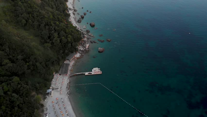 Rocky Shores With Vegetation At Jaz Beach On Adriatic Coast Of Montenegro. aerial