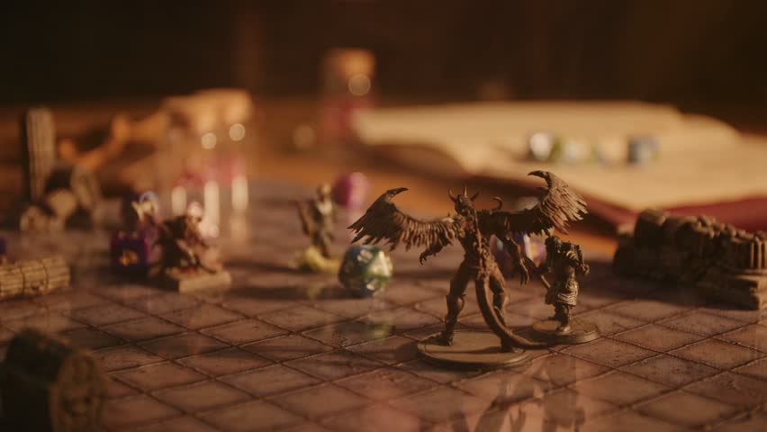 A person plays a fantasy roleplaying game, moving miniatures and rolling dice Royalty-Free Stock Footage #1103958023