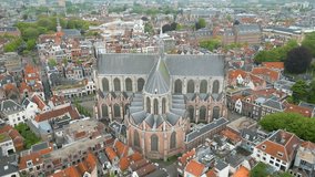 This aerial drone video shows the beautiful old city of Leiden, Zuid-Holland, the Netherlands. In this video you can see a beautiful old church. 