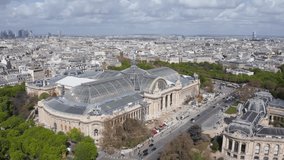 Aerial view of Grand Palais and Champs-Élysées street wit Arch de Triumph on horizon in Paris
