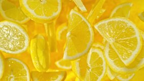 Super slow motion of flying lemon slices on black background. Filmed on high speed cinema camera, 1000 fps. Camera placed on high speed cine bot, tracking the object. Speed ramp effect. - Powered by Shutterstock - Get 15% off with code: PIKWIZARD15