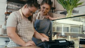 Down syndrome girl learning how to use a cash register. Shot with RED helium camera in 8K