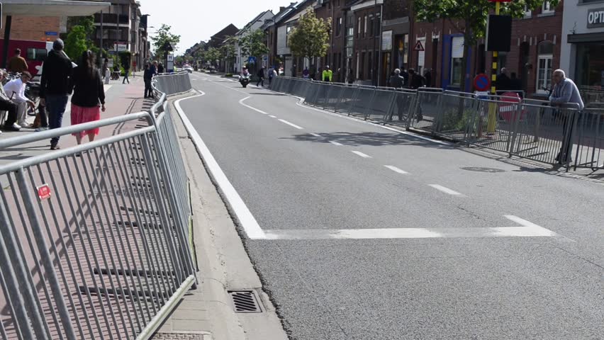 Wilsele, Vlaams-Brabant, Belgium - May 18, 2023: free entry to the local annual Ladies Elite cycling race for women. Police moto and Volvo promotional name Rodania Suisse sounds from the loudspeakers