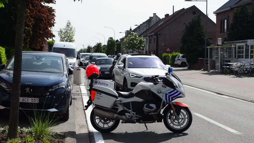 Wilsele, Vlaams-Brabant, Belgium - May 18, 2023: free access to women's local annual cycling race Ladies  Elite. Motorized BMW Police check points