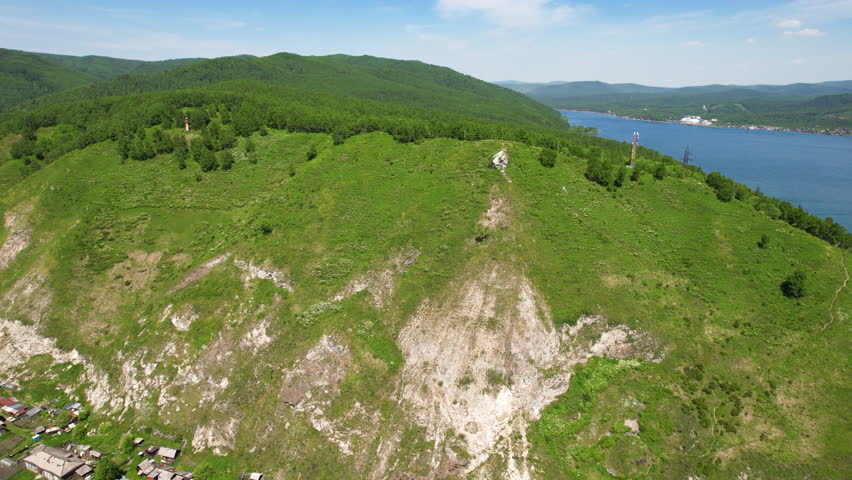 Flight to the mountain near Lake Baikal on a sunny summer day. 4k footage