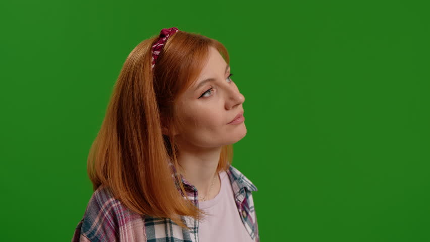 Angry young woman arguing on green screen background. Female gesturing a lot and shouting indoors. Negative human emotions and argument concept. | Shutterstock HD Video #1103990121